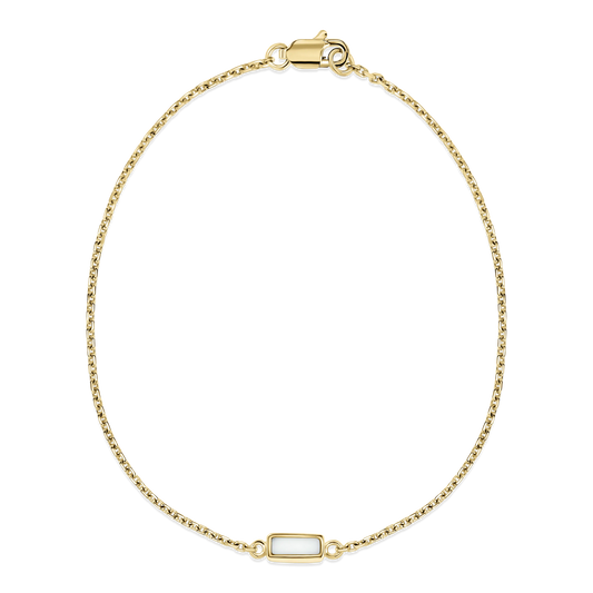Britt yellow gold breast milk bracelet with small rectangular milk stone set in a fine cable chain