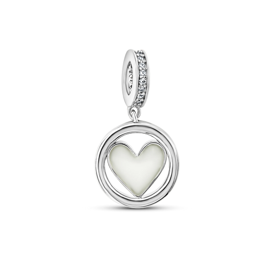 Eline silver breast milk charm with heart-shaped milk stone in a round ring and cubic zirconia bail