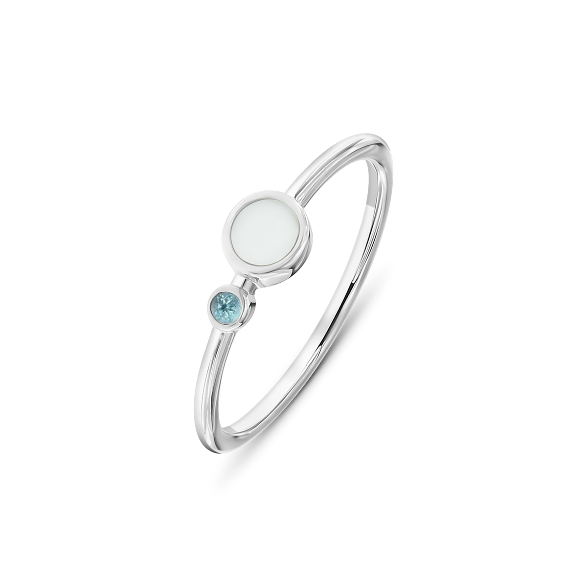 White gold Giulia breast milk ring with a round milk stone and a small December blue topaz birthstone below it