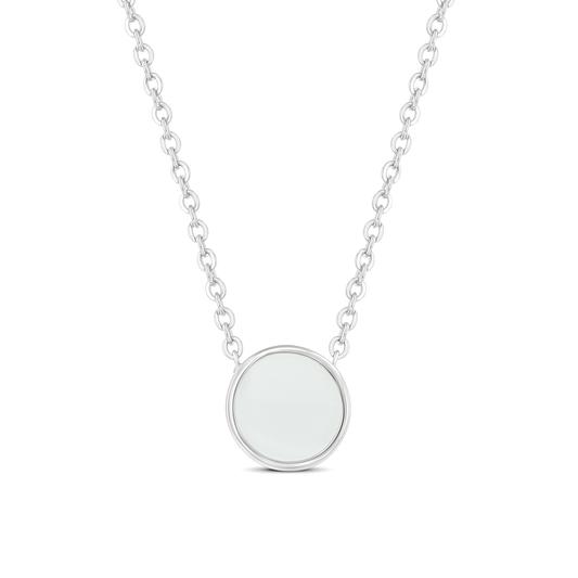 Lis silver necklace with a round breast milk stone in a bezel setting between two chain ends