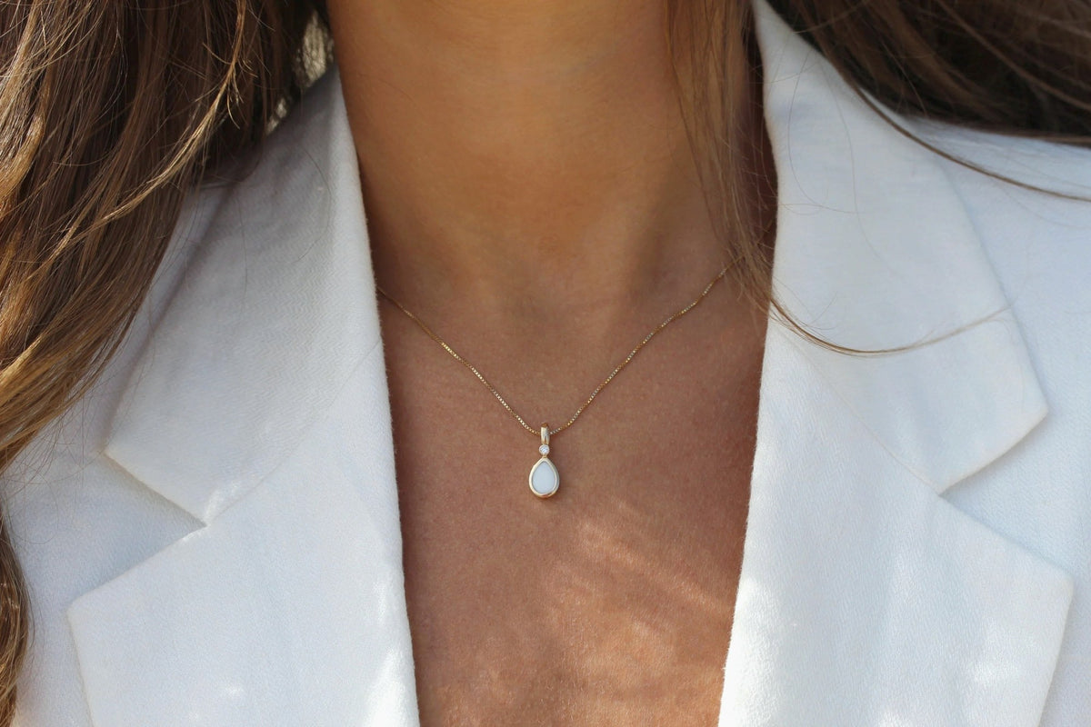 Magic Drop breast milk necklace worn